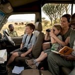 Family in safari vehicle, Uganda park wildlife