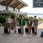 Travelers outside Entebbe International Airport entrance